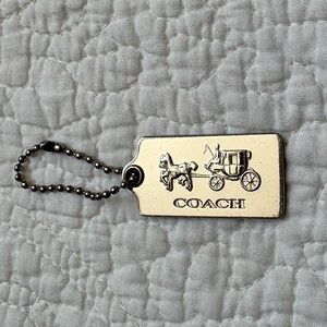 Coach metal horse and carriage hangtag